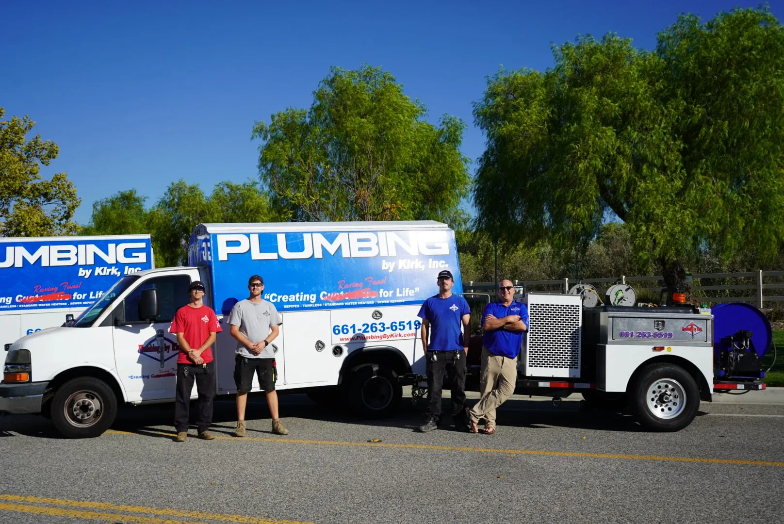 Plumbing by Kirk's crew with two service trucks and the hydro jetting trailer